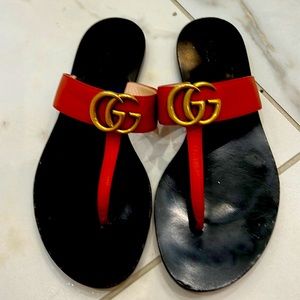 Orange Gucci flip flops
